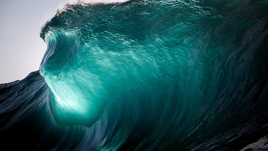 New Photographs of Waves Crashing Against the Setting Sun by Warren Keelan
